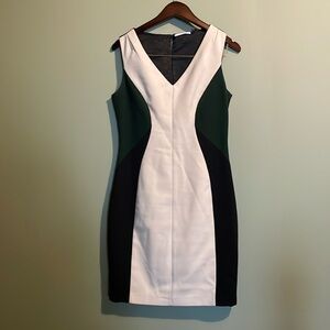 Tahari V neck sheath dress. Fully satin lined. Exposed zipper detail.